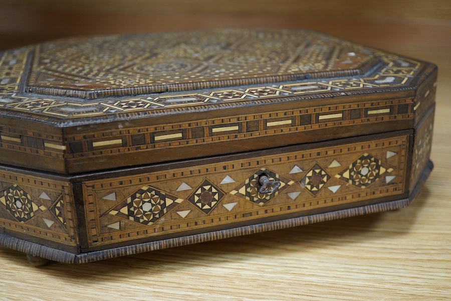 A 20th century Damascus ware heavily inlaid box, 31cm x 31cm. Condition - ball foot missing, inlay good